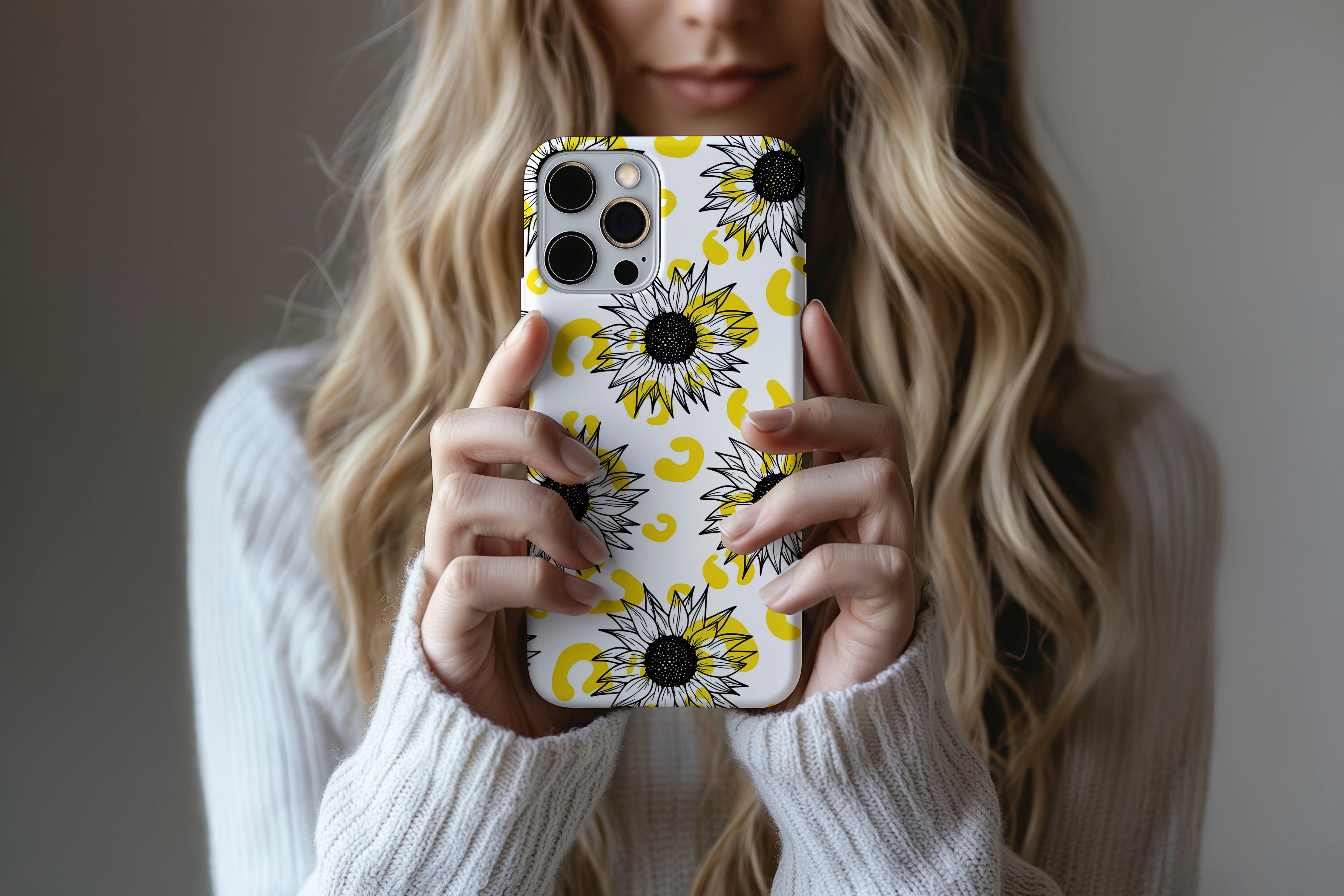 Lifestyle image of Sunflowers phone case showing floral print design