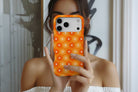Lifestyle image of Sunlit Daisies magnetic tough case showing floral print design