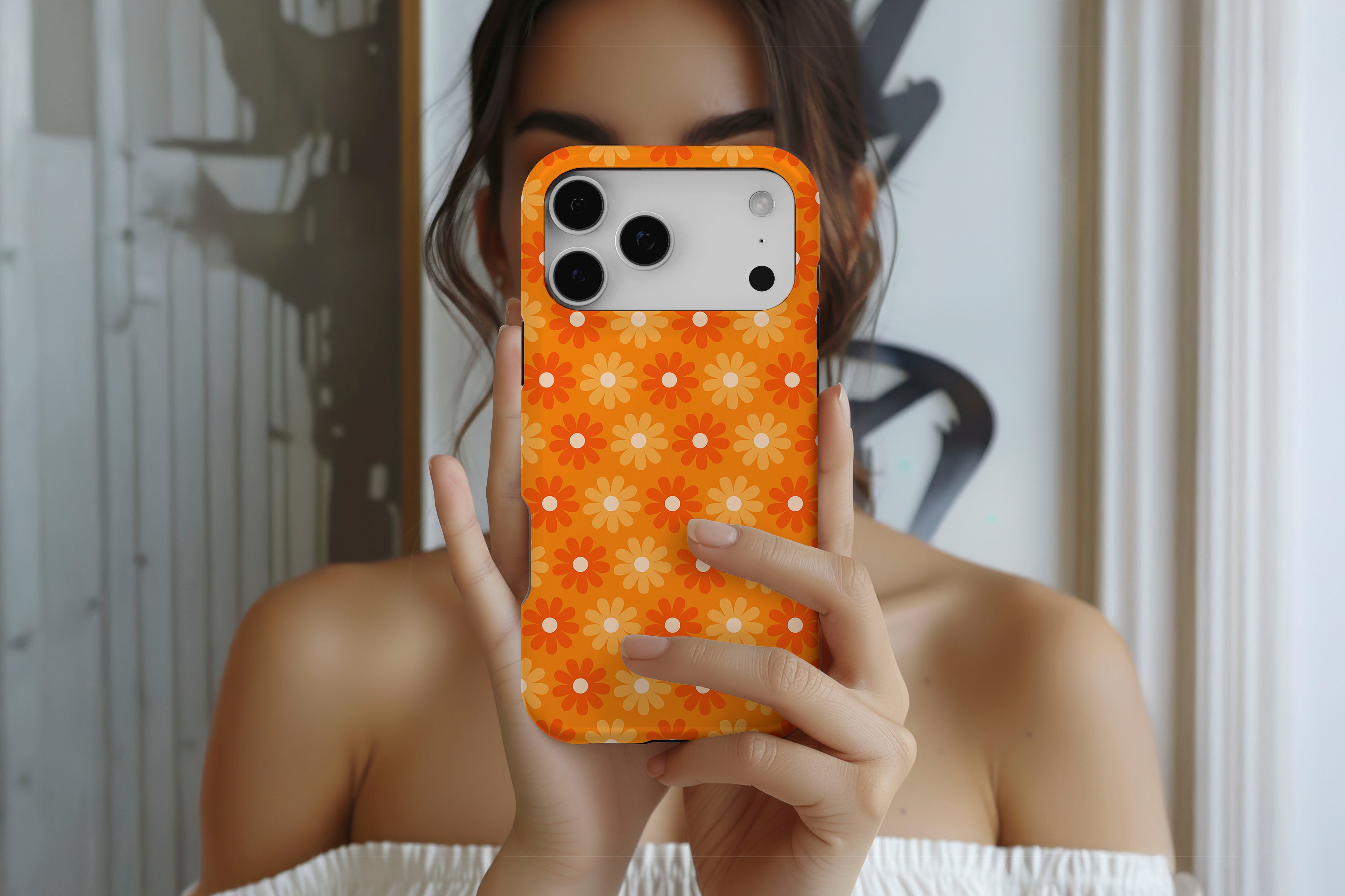 Lifestyle image of Sunlit Daisies magnetic tough case showing floral print design