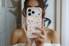 Lifestyle image of Terrazzo Nude Print magnetic tough case showing speckled terrazzo print 