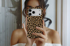 Lifestyle image of Wild Side magnetic tough case showing leopard print design